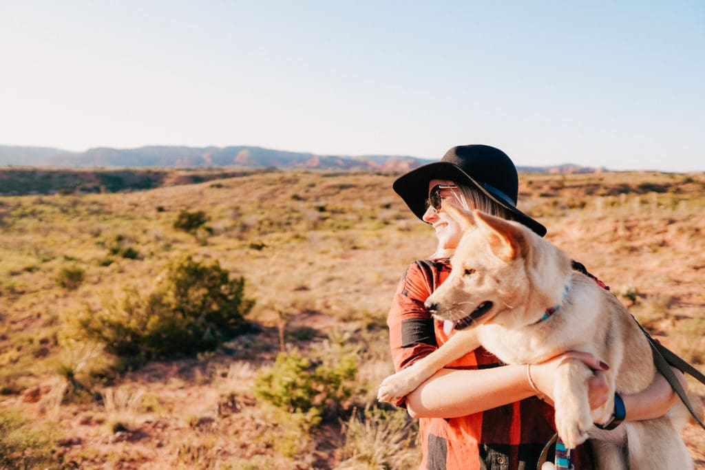 girl and dog with landscape